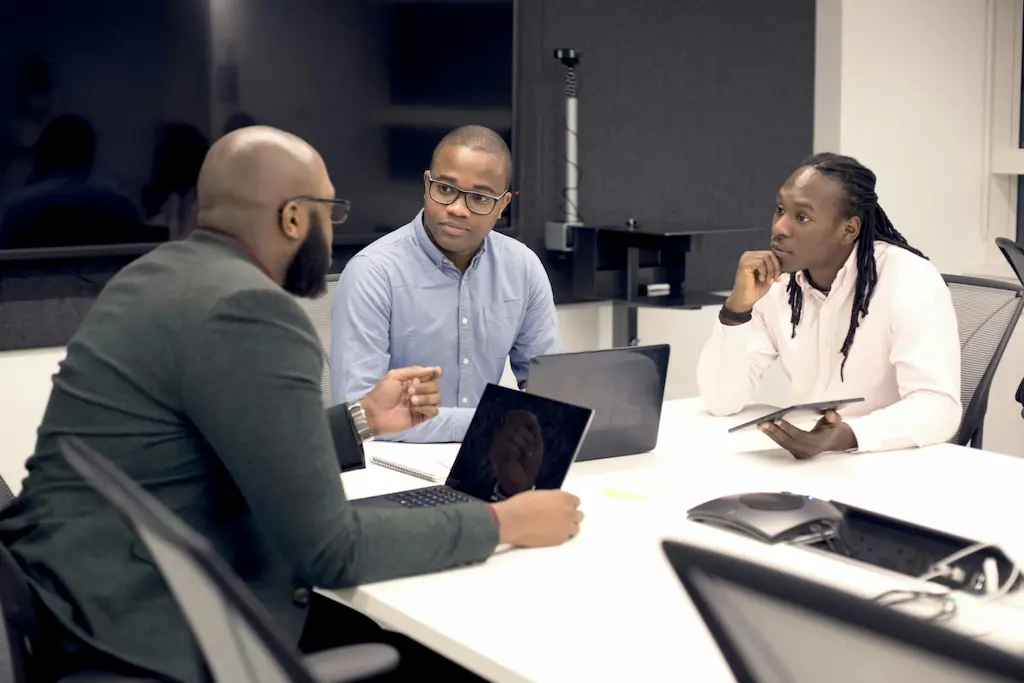 Business advisory meeting with professionals discussing strategy, growth plans, and market analysis
